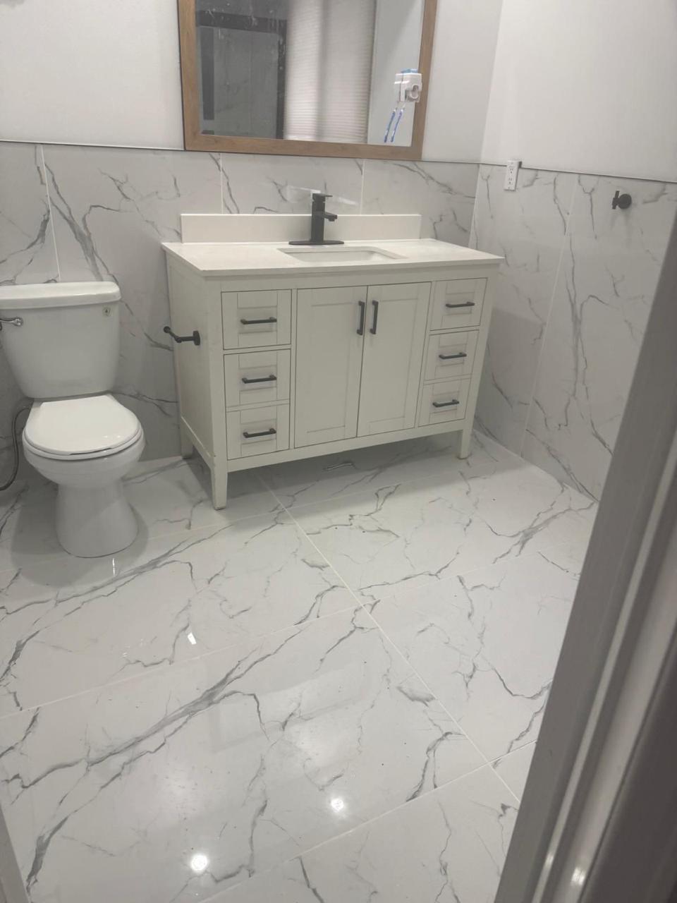 Bathroom vanity with black hardware